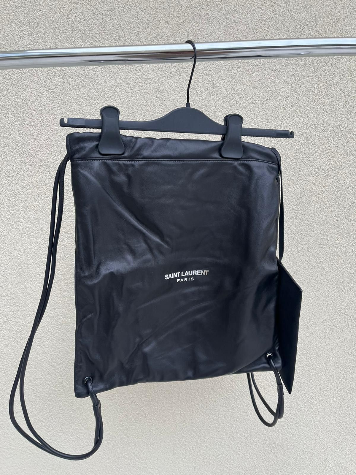 Saint Laurent Paris Lambskin Leather Logo Drawstring Backpack in Black TOP DRWR