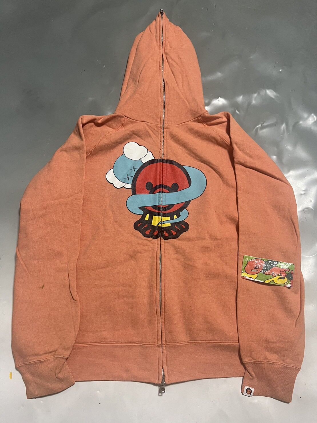 Kaws bape hoodie hotsell